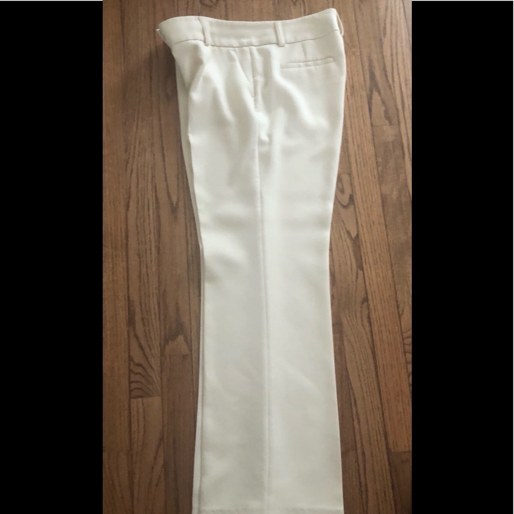 Classic white pants. 4” zipper. 2 front pockets.